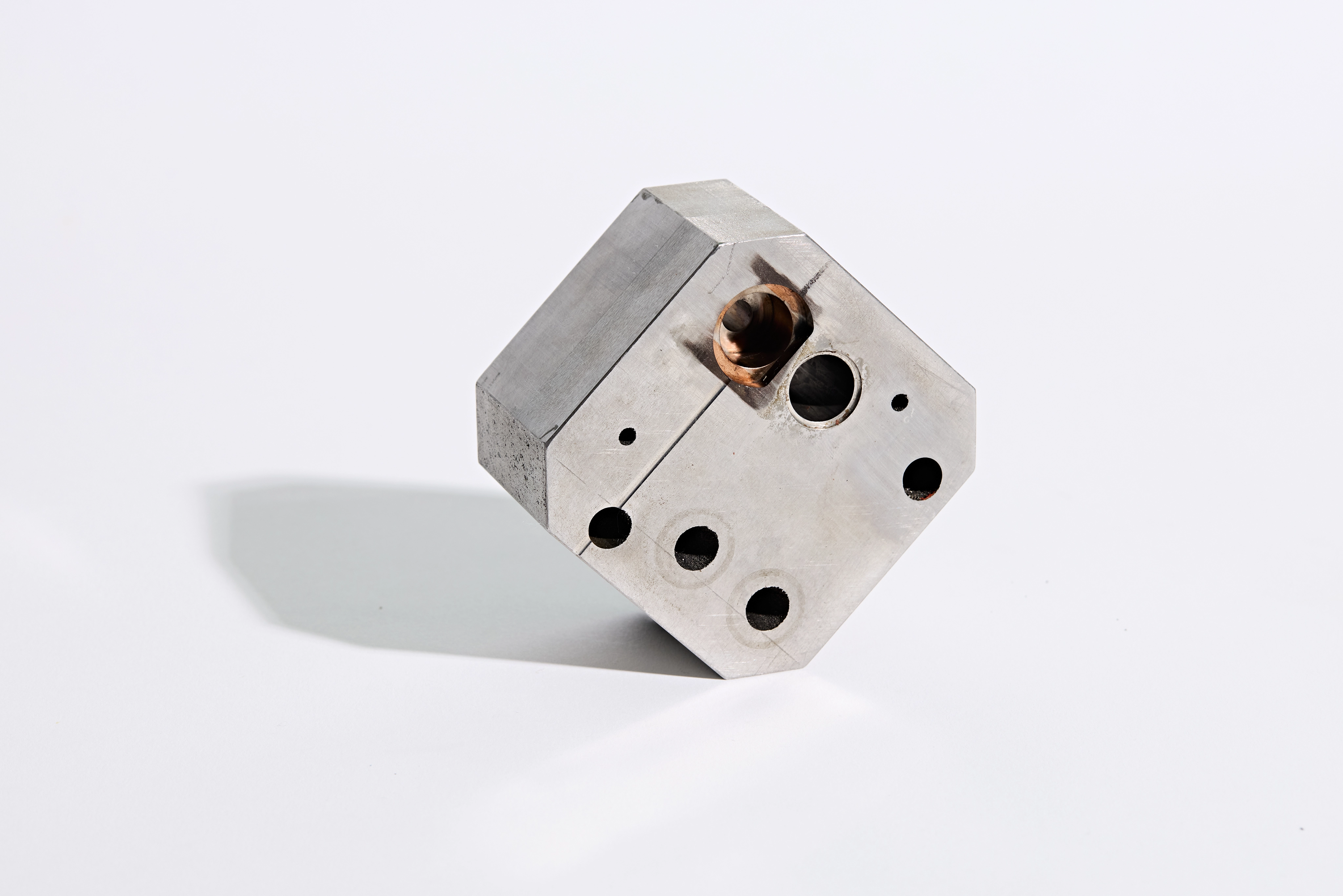 Hand holding a 3D-printed metal alloy component