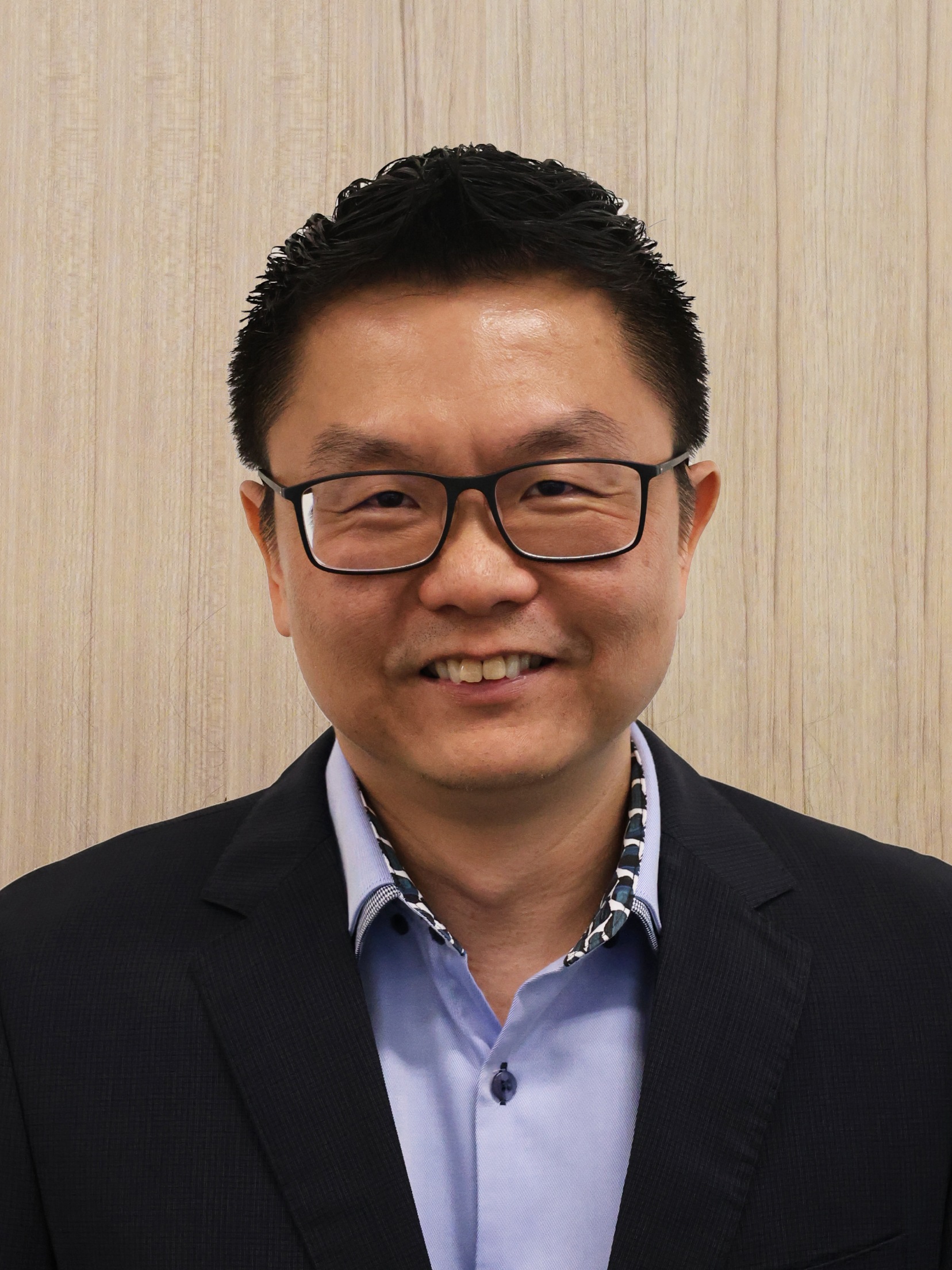 Mr Dennis Tan (Front)