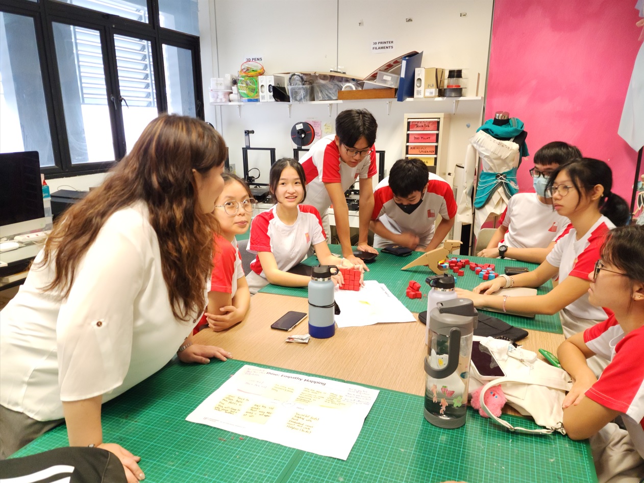 Innovation Factory’s Industrial Designer Rachel Ng coaching students from National Junior College on a Design Thinking Workshop.