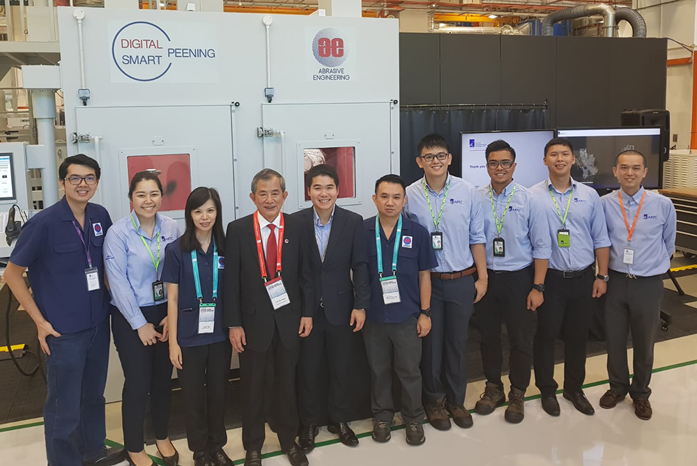 Abrasive Engineering Team with ASTAR ARTC scientists and their shot peening machine