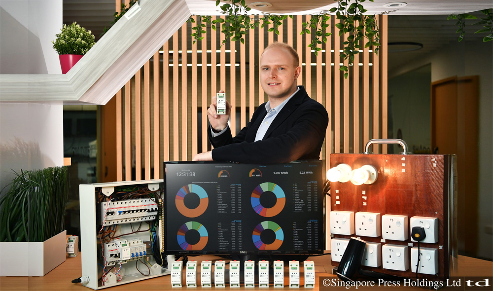Mr William Temple, 31, Ampotech chief executive officer, with the AmpoHub device, at his lab space.