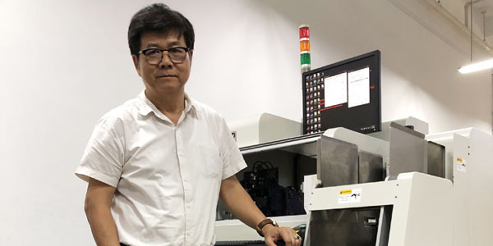 Component Technology CEO and managing director Berne Chung with the first-of-its-kind 3D automated wire bond inspection system his company developed in collaboration with A*STAR.