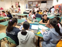 Students sharing their design ideas with Innovation Factory’s Product &amp; UI/UX Designer, Audrey Ng.