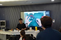 Zi Hao, from Para ( ) Studios conducting a hands-on workshop on constructing kinetic Kirigami sculptures.